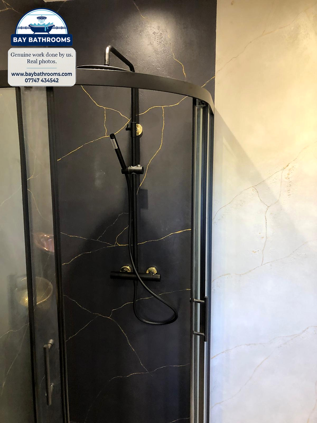 Black and gold-veined shower walls